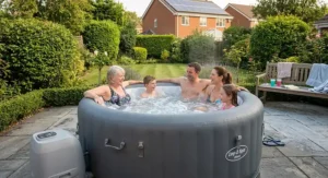 Family enjoying a warm soak in an inflatable hot tub on a paved British patio deck
