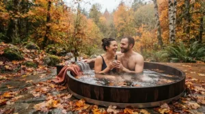 Couple relaxing in an inflatable hot tub for cold weather surrounded by autumn leaves